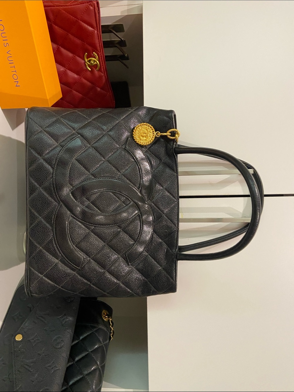 CHANEL Black Quilted Leather Tote with Gold Medallion Charm